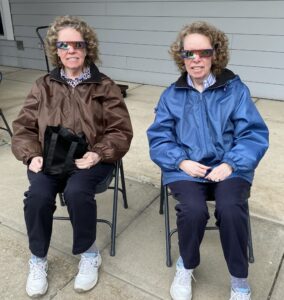 Resident twins, Janice and Joanne, wear protective glasses as they prepare to watch the solar eclipse.