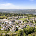 Aerial view of Kendal at Ithaca's beautiful 105 acre campus surrounded by hills and Cayuga lake.